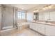 Bright bathroom featuring double vanity, tub and separate glass enclosed shower at 11715 Crow Hill Dr, Parker, CO 80134
