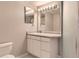 Bathroom featuring decorative mirror and single sink vanity at 11715 Crow Hill Dr, Parker, CO 80134