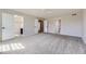 Spacious bedroom featuring walk-in closet with built-ins and neutral gray walls and carpet at 11715 Crow Hill Dr, Parker, CO 80134