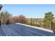 Outdoor deck showcasing scenic neighborhood views with black metal railings and gray composite deck boards at 11715 Crow Hill Dr, Parker, CO 80134