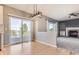 Dining room with sliding glass doors and view of the living room and fireplace at 11715 Crow Hill Dr, Parker, CO 80134