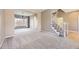 Neutral living room with carpet, staircase, and large entryways at 11715 Crow Hill Dr, Parker, CO 80134