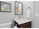 Bathroom featuring a modern vanity with granite countertops, stainless steel faucet, and modern decor at 9912 Silver Maple Rd, Highlands Ranch, CO 80129