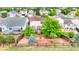 View of backyard featuring a deck, fire pit, trees, and a lawn at 22160 Wintergreen Way, Parker, CO 80138