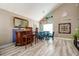 Elegant dining room with a bar area, modern chandelier, and unique wall decor at 22160 Wintergreen Way, Parker, CO 80138