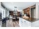 Stylish kitchen with an island, modern appliances, and open flow into the dining area at 22160 Wintergreen Way, Parker, CO 80138