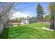 Exterior backyard showcasing a lush lawn, wood fence, and plenty of space at 833 Osceola St, Denver, CO 80204