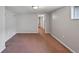 Unfinished basement space with access to utility room and closet at 833 Osceola St, Denver, CO 80204