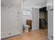 Bathroom features tiled shower, tiled floor, white toilet and sink with vanity at 833 Osceola St, Denver, CO 80204