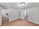 Neutral bedroom boasts soft carpet, light walls, two entryways and overhead lighting at 833 Osceola St, Denver, CO 80204