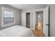 Light-filled bedroom with hardwood floors, a closet, and neutral paint at 833 Osceola St, Denver, CO 80204