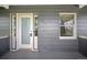 Covered front porch showing house number and window at 833 Osceola St, Denver, CO 80204