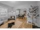 Cozy living room featuring hardwood floors, neutral walls, and ample natural light at 833 Osceola St, Denver, CO 80204