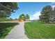 Beautiful park with a sidewalk and colorful playground under a clear blue sky at 833 Osceola St, Denver, CO 80204