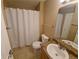 Cozy bathroom with a vanity, toilet, and shower-tub combination with a curtain at 18051 E Kentucky Ave # 201, Aurora, CO 80017