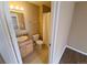 Standard bathroom with a wood vanity, toilet, and shower-tub combination at 18051 E Kentucky Ave # 201, Aurora, CO 80017