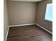 Neutral bedroom with wood floors and a window for natural light at 18051 E Kentucky Ave # 201, Aurora, CO 80017