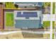 View from above of home's roof with solar panels, grass, rock features, and walkway at 10912 Memphis Ct, Commerce City, CO 80022