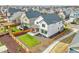 Aerial shot of a white home with a fenced backyard in a residential area at 10912 Memphis Ct, Commerce City, CO 80022