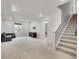 Finished basement with neutral carpet, recessed lighting, and a staircase at 10912 Memphis Ct, Commerce City, CO 80022