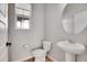 Bathroom featuring a modern pedestal sink at 10912 Memphis Ct, Commerce City, CO 80022
