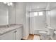 Bathroom features a granite-topped vanity, toilet, and shower/tub combination at 10912 Memphis Ct, Commerce City, CO 80022