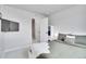 Bright bedroom features soft carpet, neutral walls, and a door leading to other rooms at 10912 Memphis Ct, Commerce City, CO 80022
