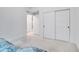 Bright bedroom featuring neutral carpet, closet with sliding doors and multiple entryways at 10912 Memphis Ct, Commerce City, CO 80022