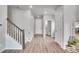Hallway with stairs and open floor plan at 10912 Memphis Ct, Commerce City, CO 80022