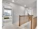 Upstairs hallway with wooden banister leading to bedrooms and bathrooms at 10912 Memphis Ct, Commerce City, CO 80022