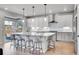 Modern kitchen features granite countertops, a large island, and stainless steel appliances at 10912 Memphis Ct, Commerce City, CO 80022