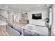 Open living room with light hardwood flooring, white walls, and recessed lighting fixtures at 10912 Memphis Ct, Commerce City, CO 80022