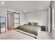 Bright main bedroom has a large closet and comfortable bed at 10912 Memphis Ct, Commerce City, CO 80022