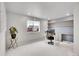 Office includes a large desk, wall shelving, and a window overlooking the neighborhood at 10912 Memphis Ct, Commerce City, CO 80022