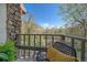 Balcony overlooking beautiful views of the surrounding yard, with comfortable seating to enjoy the great outdoors at 80 Clear Creek Ln # 10, Golden, CO 80403