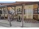 Unique home featuring a welcoming entrance with wooden stairs, rock landscaping, and a charming exterior at 80 Clear Creek Ln # 10, Golden, CO 80403