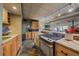 Modern kitchen featuring granite countertops, sleek appliances, and seamless transition to living space at 80 Clear Creek Ln # 10, Golden, CO 80403