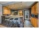 Updated kitchen with bar seating, modern appliances, and sleek stone countertops at 80 Clear Creek Ln # 10, Golden, CO 80403
