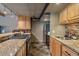 Well-equipped kitchen featuring stone counters, wooden cabinetry and modern stainless steel appliances at 80 Clear Creek Ln # 10, Golden, CO 80403