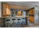 Open kitchen with bar seating, modern appliances, and stylish pendant lighting at 80 Clear Creek Ln # 10, Golden, CO 80403