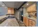 Updated kitchen with stone counters, wooden cabinetry and modern stainless steel appliances at 80 Clear Creek Ln # 10, Golden, CO 80403