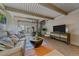 Inviting living room with comfortable sofa, wood stove, and a spiral staircase to the upper level at 80 Clear Creek Ln # 10, Golden, CO 80403