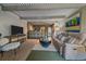 Inviting living room featuring a cozy sofa, bar seating, and an open layout into the kitchen at 80 Clear Creek Ln # 10, Golden, CO 80403