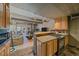 Cozy living room features a spiral staircase, comfortable seating, and open layout into the kitchen at 80 Clear Creek Ln # 10, Golden, CO 80403