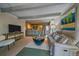 Charming living room featuring a cozy sofa, bar seating, and an open layout into the kitchen at 80 Clear Creek Ln # 10, Golden, CO 80403