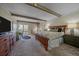 Spacious main bedroom with beautiful wood trim, a walk-out balcony, and a separate area for an office at 80 Clear Creek Ln # 10, Golden, CO 80403