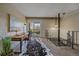 The home office offers a desk, a balcony, a unique hide rug, and easy access to an upper story at 80 Clear Creek Ln # 10, Golden, CO 80403