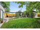 Well-maintained backyard with green grass, patio area, and privacy fencing at 1331 Osceola St, Denver, CO 80204