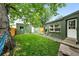 Backyard featuring green grass and lush trees at 1331 Osceola St, Denver, CO 80204