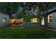 Private backyard with green lawn, patio area, and charming ambiance, perfect for outdoor gatherings at 1331 Osceola St, Denver, CO 80204